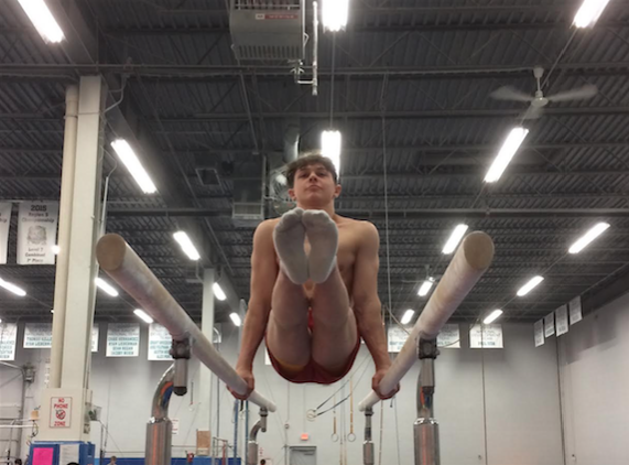 Juda practices for the Parallel Bars event at his gym, the Buffalo Gove Gymnastics Center. 