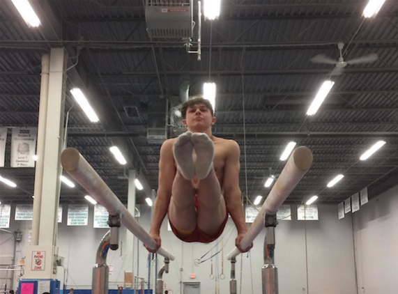 Juda practices for the Parallel Bars event at his gym, the Buffalo Gove Gymnastics Center.