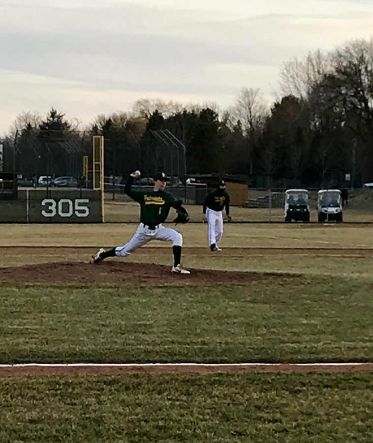 Nick Brueckert 19 puts the finishing touches on an opening day victory for the patriots. Brueckert caught the flip from Nick Bonk 18 to complete the groundout and finish the game.