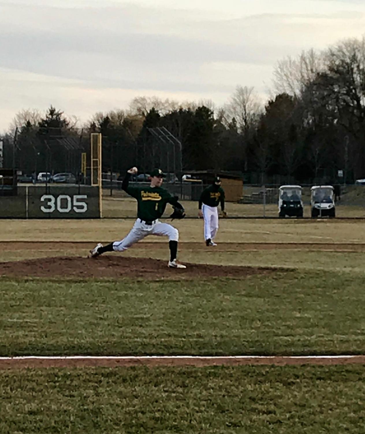 Nick Brueckert '19 puts the finishing touches on an opening day victory for the patriots. Brueckert caught the flip from Nick Bonk '18 to complete the groundout and finish the game.