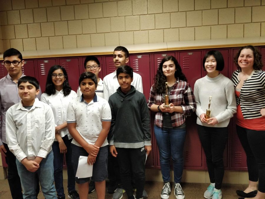 Aptakisic Junior High School debaters pose with their trophies after the tournament. Aptakisic won their 5th straight tournament title over Daniel Wright.