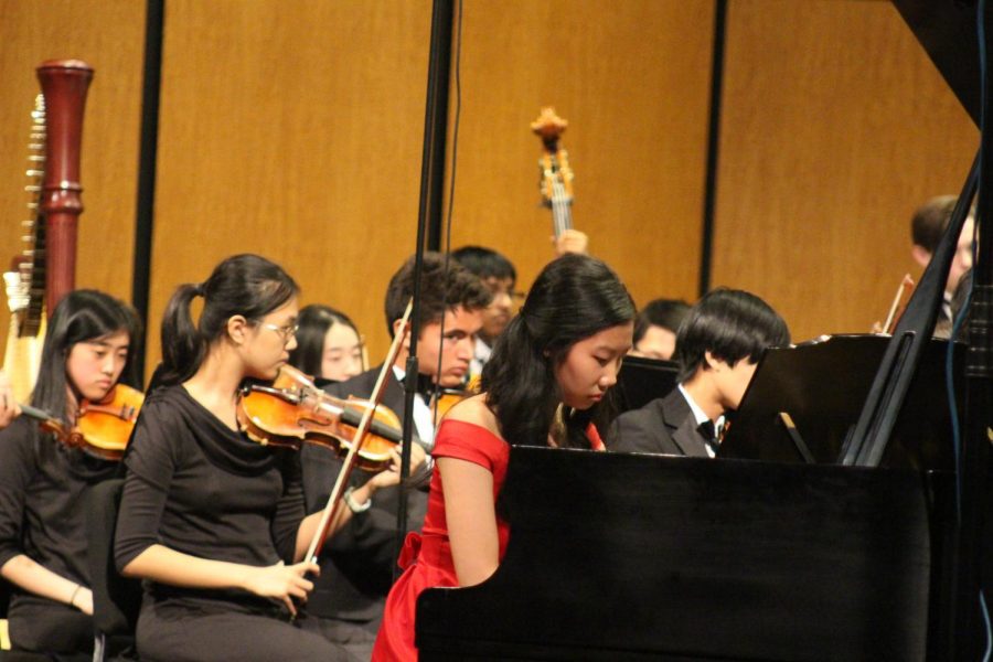 Stephanie Li 19 performs a piano concerto while the rest of Patriot Orchestra plays along. Future soloists will include Adele Lee 19 and Reid Harmon 19. 