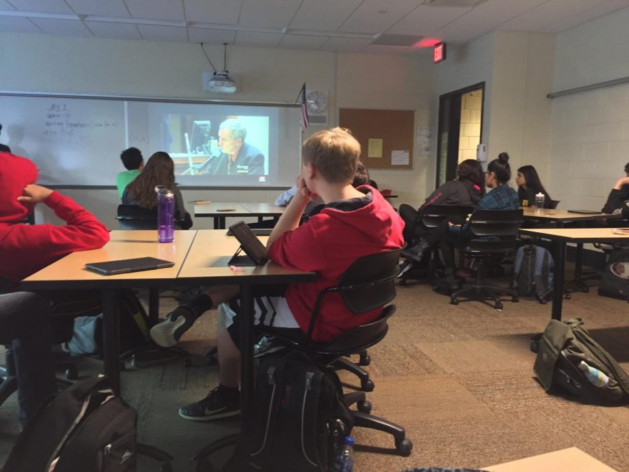 students intently watch a video regarding false confessions. The E-Board prepares presentations with videos relevant to the topic of meetings.