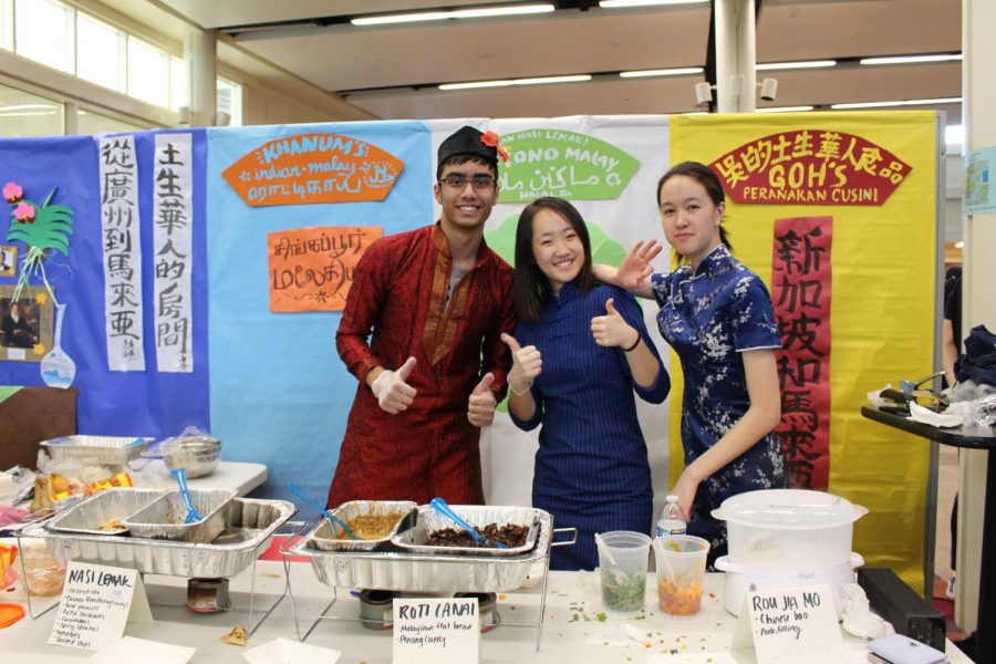 Shisir Bandapalli 21, Diane Bi 21, and Clare Hu 21 all helped out at the Malaysian booth.  They were all eager to share Malaysian cuisine: Nasi lemak, roti lani, and rou jia mo. 