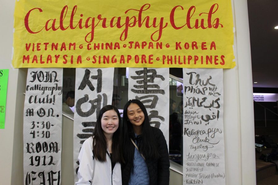 Calligraphy Club members Allison Liu 20 and Kara Lee 20 decorated their festival booth with exquisite brush strokes and watercolor pens.  The club also led a hands-on calligraphy activity for the children.