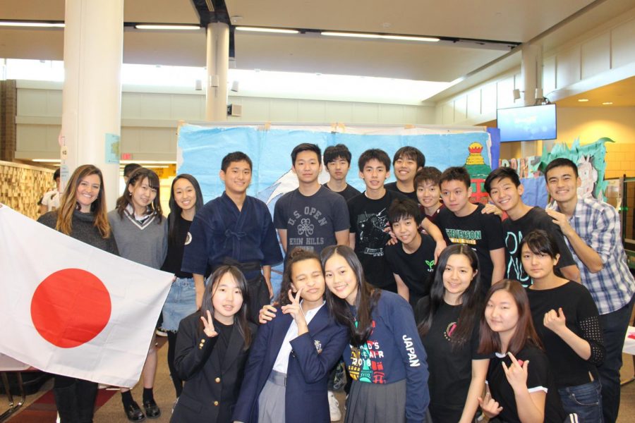 Rei Kubota 20, Japanese club president, poses with his fellow club members and sponsor.  Later, during the performances, the group showcased a traditional folk dance called Soran. 