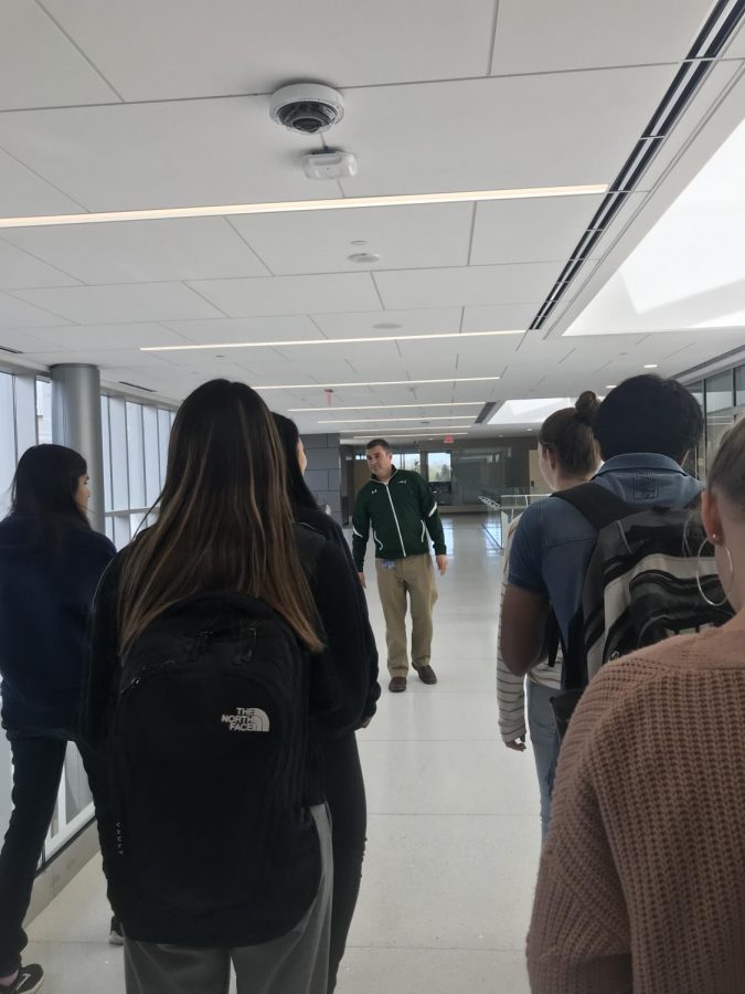 Students follow Mr.Gobble one of the main hallways of the new addition to the East Building. Classes are set to start in the new addition in fall of 2019. ​