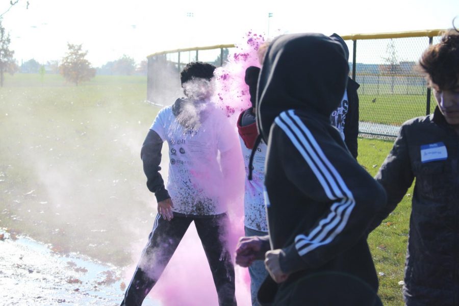 Color powder explodes on impact when it collided with this unfortunate runner.