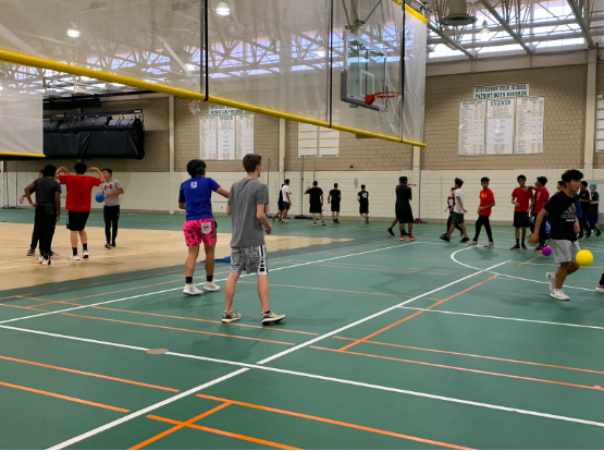 After a game, students to warm up before their next rounds. The dodgeball tournament was bracket style, with a team being eliminated each game until there was only one left.