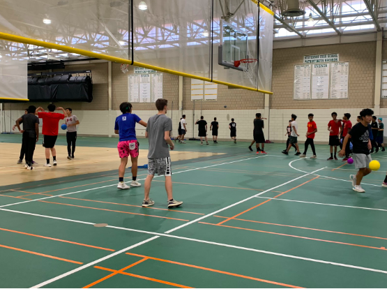 After a game, students to warm up before their next rounds.  The dodgeball tournament was bracket style, with a team being eliminated each game until there was only one left.