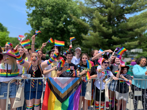 Students not marching in the parade cheer in support of the marchers. This year marks the return of a larger number of attendees, as the pandemic prevented crowds from gathering along the parade route for the past two years.