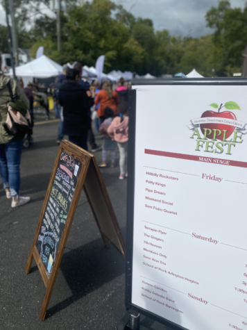 A sign showcases the schedule of performers on display during the multi-day event. Apple Fest featured a wide variety of upcoming artists ranging in styles from rock to country.