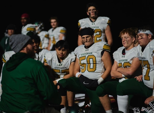 Offensive-line coach Tom McGovern gives the offensive line some guidance during halftime. Center Remy Herrejon ’23 and offensive guards Nathan Stefanov ’23 and Hugo Garcia ’23 have been the anchor for a strong run-game all season.