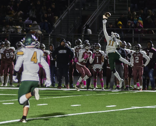 Cornerback Charlie Skolnik ’23 leaps in the air to tip the pass intended for a Zion-Benton receiver. The Patriots have pitched back-to-back shutouts and have only allowed an average of 14.7 points per game for their seven games played.