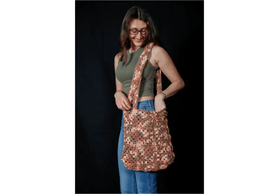 Christina Santello ’23 models her crochet handbag. Santello started selling her crochet items after interest from her friends.