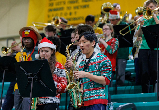 Stevenson’s band plays in the stands during the game.. Musicians showed their holiday spirit with colorful sweaters and winter songs.