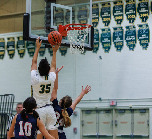 Emory Klatt ’24 makes a tough contested layup in the paint. Stevenson relied heavily on her and Kate Arne ’23 in the post throughout the game.