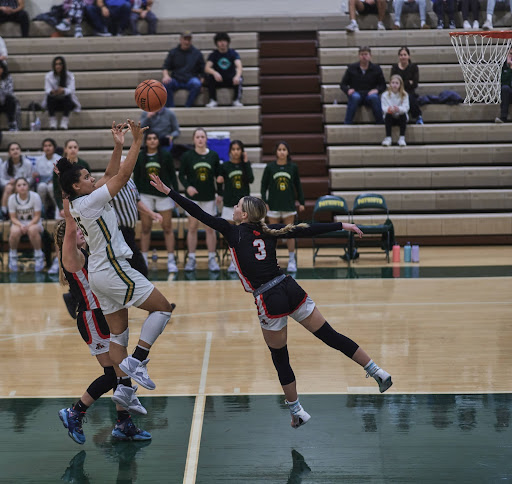 Libertyvilles Emily Fisher ’23 plays good transition defense against Emory Klatt ’24. Libertyville played exceptional defense and stopped Stevenson from getting easy layups in transition.