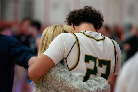 Brandon Sorokin ’23 shares a moment with his mother after the game. Sorokin hit several big shots throughout the game to give Stevenson the momentum down the stretch. 