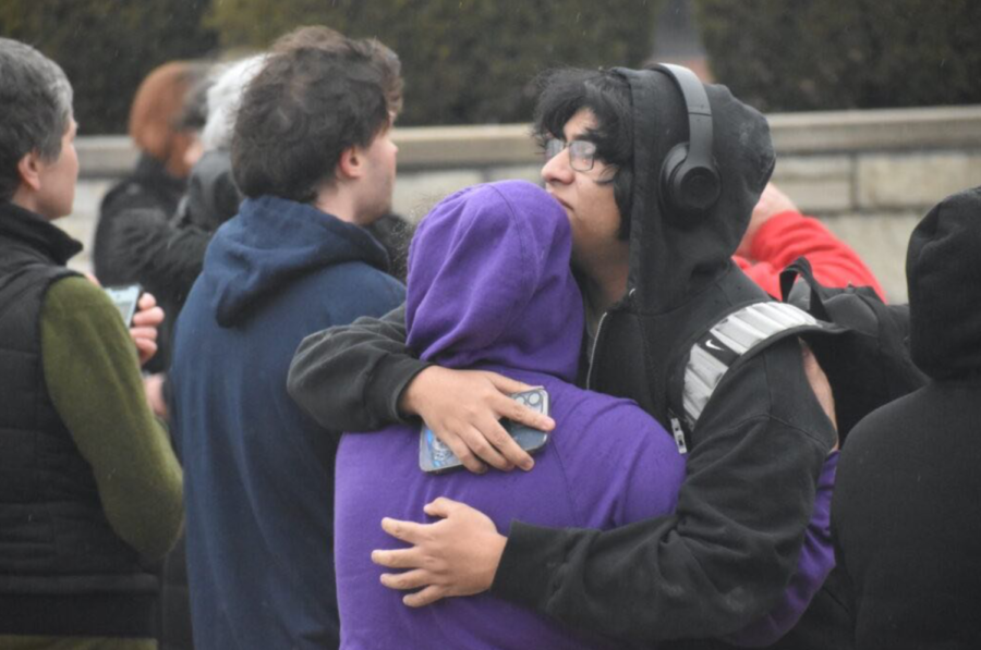 Highland Park parents and students hug after the lockdown finished. The school was under lockdown for 90 minutes before police verified the gun threat had been removed. 