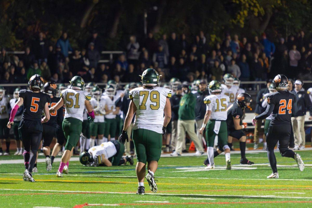 Andrew Timmons ’25 walks across the field getting ready for the next Patriots drive after a first down. The Patriots offense was stellar all night, scoring five touchdowns en route to the 35-28 win. 