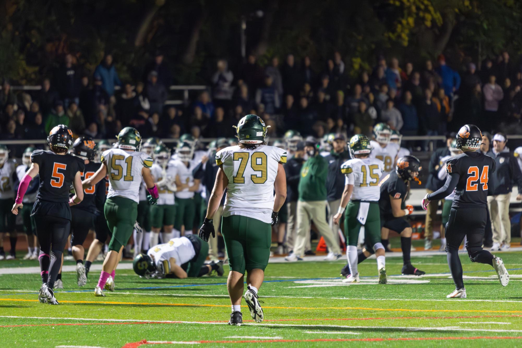 Andrew Timmons ’25 walks across the field getting ready for the next Patriots drive after a first down. The Patriots offense was stellar all night, scoring five touchdowns en route to the 35-28 win. 