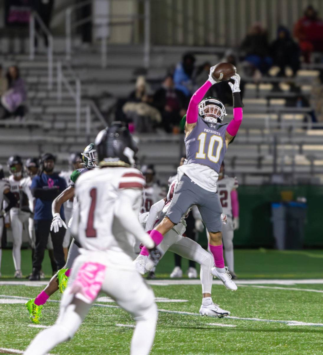 Thomas Simmons ’25 intercepts a pass from the Zion-Benton quarterback early in the game. The Patriots’ strong defense was featured throughout the game, as they racked up multiple sacks and critical tackles.