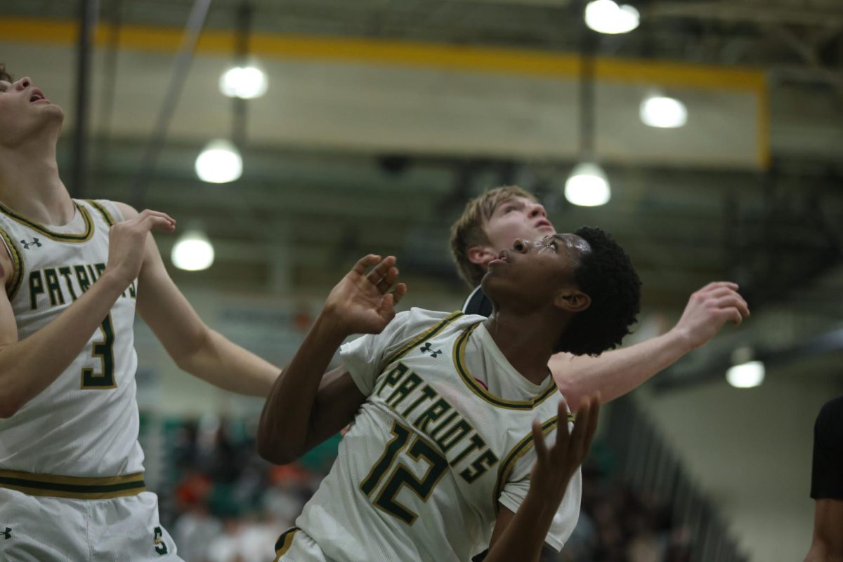 Armand Burris 24 watches his layup as it goes in at a home game. Burris is an integral part of the team, helping create opportunities.