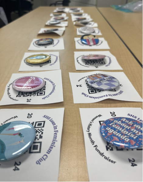 Lean in Feminism works to make an assortment of buttons. These will later be sold for their fundraiser for A Safe Place throughout the month of March. 