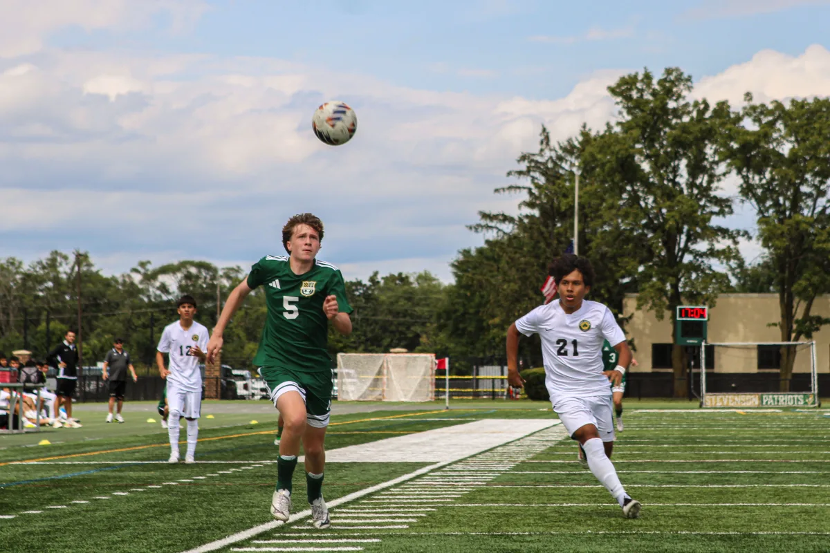 Brady Brunner ’28 pursues the ball against Chicago Saint Patrick. Brunner fought to hold possession of the ball for the Patriots throughout the game in addition to scoring a goal for Stevenson in the last sixteen seconds of the first half.