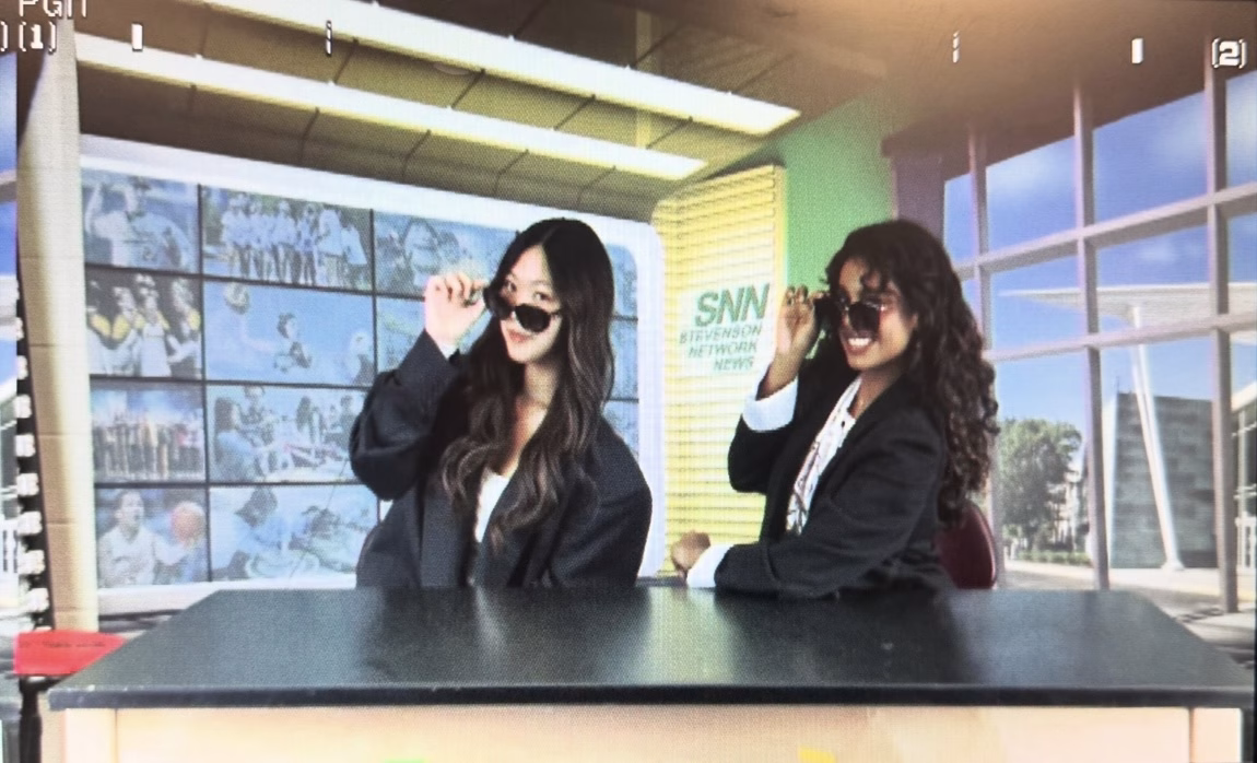 Photo taken through the SNN filming camera of Victoria Cai ’26 and Abia Jeelani Jeelani Basha ’26 as they pull their sunglasses halfway down. At the end of filming for each SNN video, anchors like Basha and Cai always add a fun element to the last scene.