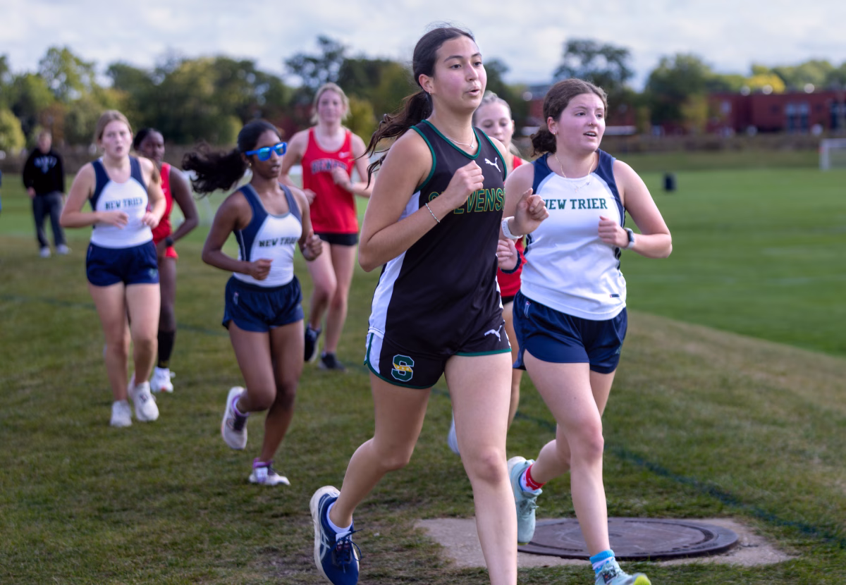 Ana Ortiz Manzanares ‘27 runs her first mile of the three mile race, with New Trier runners close behind. Manzanares is in her third year of cross country and enjoyed running in middle school. 