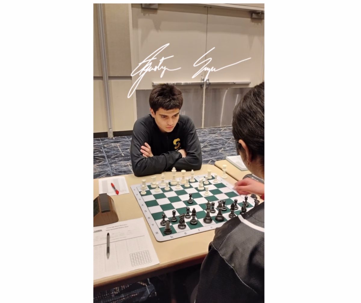 An autographed photo of Auggie Sapru ’26 facing off against an opponent at the IHSA State Championship. He went undefeated, winning all 6 of his games. Photo courtesy of Ken Wallach.